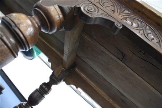 A large carved oak refectory table, 11ft 8in. x 2ft 11.5in. x 2ft 6.5in.